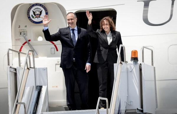 Vice President Kamala Harris and her husband, Douglas Emhoff wave as they board their plane to depart the Julius Nyerere International Airport in Dar es Salaam, Tanzania, to Lusaka, Zambia, at the end of their visit to Tanzania, on March 31, 2023. (Ericky Boniface/AFP via Getty Images)