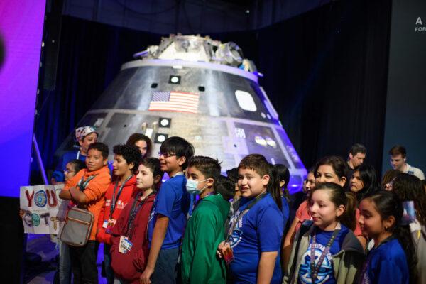 Children wait for the Artemis II crew announcement at Ellington Field in Houston on April 3, 2023. (Mark Felix/AFP via Getty Images)