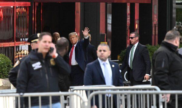 Former President Donald Trump waves as he arrives at Trump Tower in New York on April 3, 2023. (ED JONES/AFP via Getty Images)