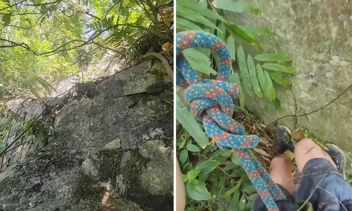 A cameraman scales and then rappels down the cliffside during the rescue of a stranded dog. (Screenshot/Newsflare)