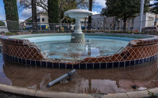 Orange County officials hold a press conference at the damaged historic fountain at Plaza Park in Orange, Calif., on March 30, 2023. (John Fredricks/The Epoch Times)