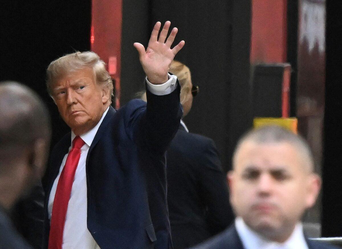 Former President Donald Trump waves as he arrives at Trump Tower in New York City, N.Y., on April 3, 2023. (Ed Jones/AFP via Getty Images)