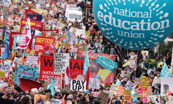 Striking members of the National Education Union on Piccadilly march to a rally in Trafalgar Square, central London, on March 15, 2023. (Aaron Chown/PA Media)