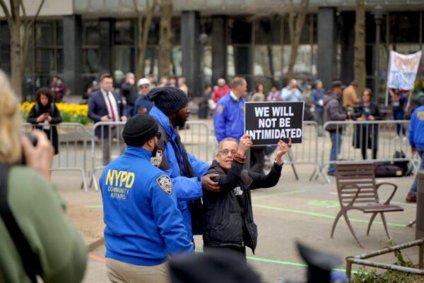 Protesters outside the New York County Supreme Court ahead of former President Donald Trump's arraignment on April 4, 2023. (The Epoch Times)