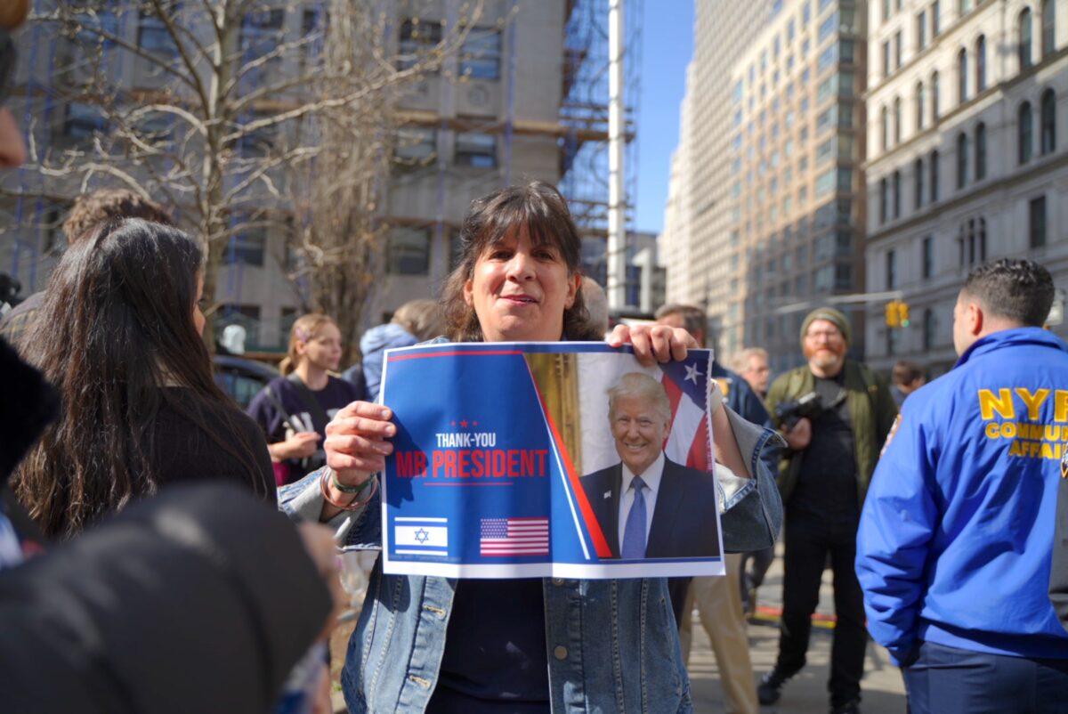 Protesters outside the New York County Supreme Court ahead of former President Donald Trump's arraignment on April 4, 2023. (Chung I Ho/The Epoch Times)