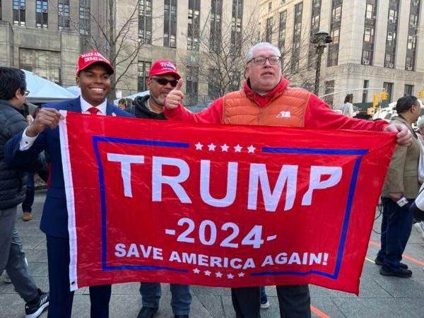 David Rem (right) of Forest Hills, New York, gathers with other supporters of former President Donald Trump in New York on April 4, 2023. (Eva Fu/The Epoch Times)