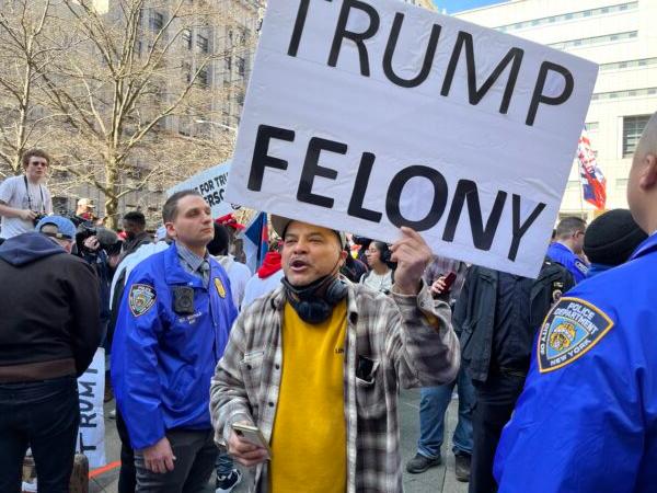 New York resident Ozzie Hernandez protests against former President Donald Trump in New York on April 4, 2023. (Eva Fu/The Epoch Times)