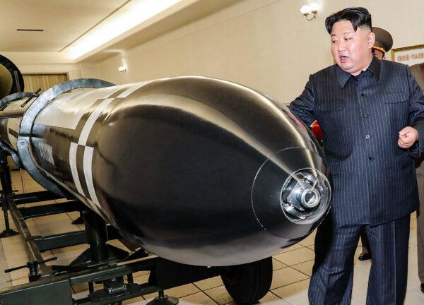 North Korean leader Kim Jong Un visits a hall displaying various types of warheads in North Korea on March 27, 2023. (Korean Central News Agency/Korea News Service via AP)