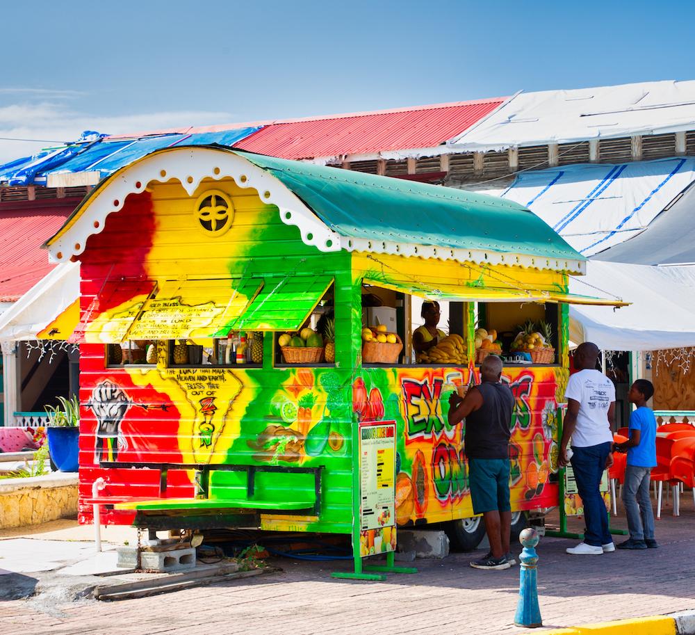 People line up for refreshments at a cart in Marigot. (Darryl Brooks/Shutterstock)