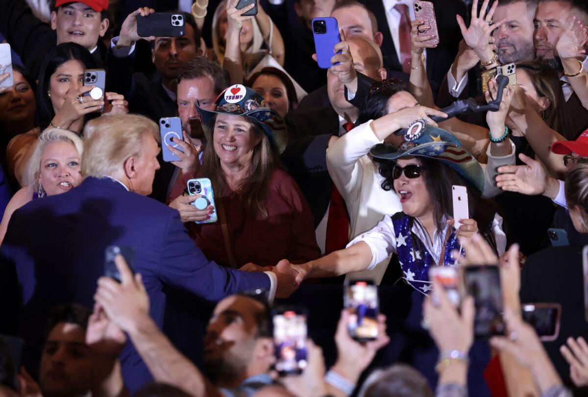 Former President Donald Trump (L) greets supporters during an event at Mar-a-Lago in West Palm Beach, Fla., on April 4, 2023. (Alex Wong/Getty Images)