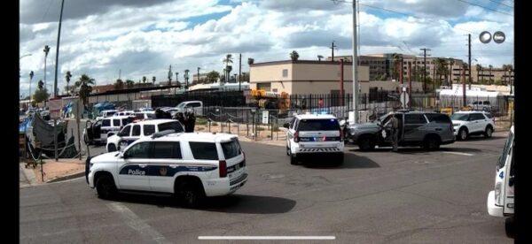 Phoenix police converge at the scene of a recent shooting in the Zone.