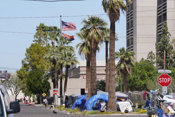 Tents set up by homeless residents in the Zone stand just a few blocks from the Capitol District in downtown Phoenix on April 3, 2023. (Allan Stein/The Epoch Times)