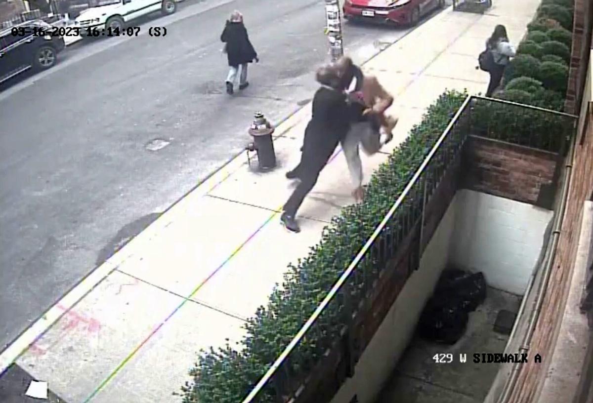 Security camera footage captures the moment when a bystander tackles the armed suspect. (Screenshot/Newsflare)