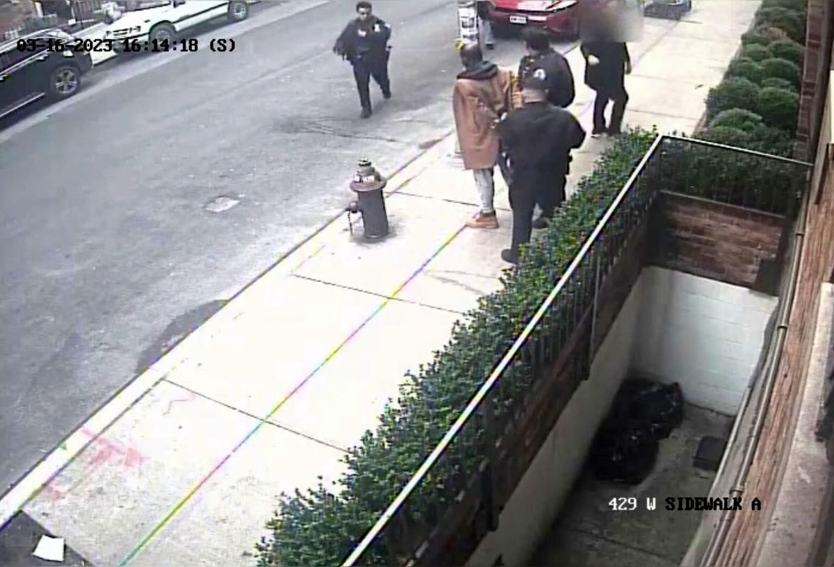 Security camera footage shows the officers taking the armed suspect into custody after he fled the bodega on foot. (Screenshot/Newsflare)