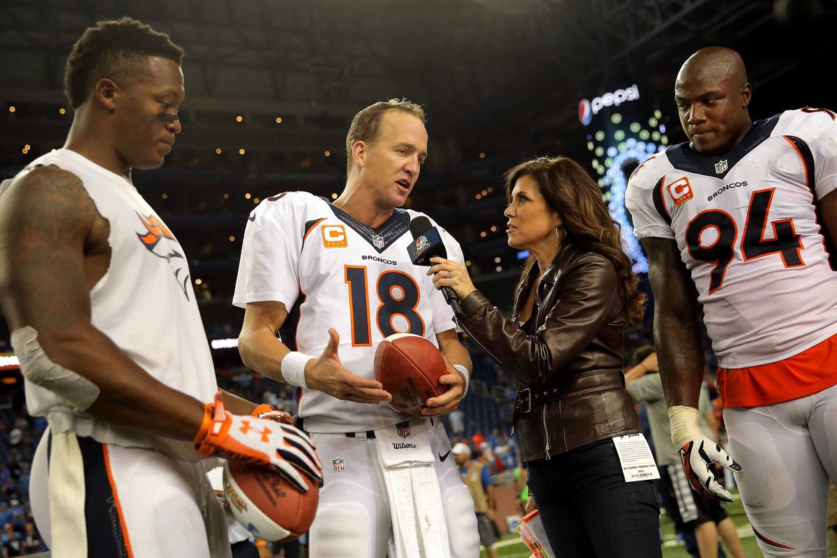 NBC Sports sideline reporter Michele Tafoya interviews the Denver Broncos: quarterback Peyton Manning along with wide receiver Demaryius Thomas and outside linebacker DeMarcus Ware after their game against the Detroit Lions at Ford Field on September 27, 2015 in Detroit, Michigan. (Doug Pensinger/Getty Images)