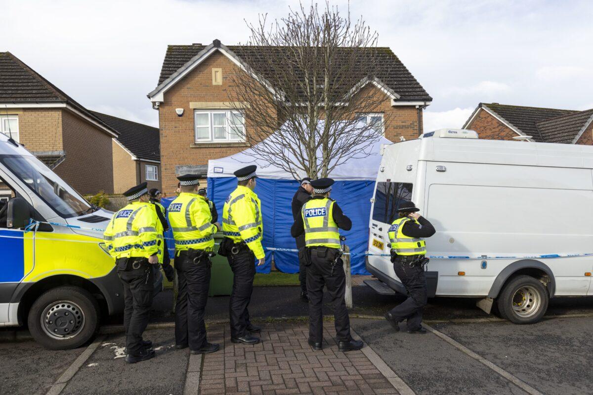 Officers from Police Scotland outside the home of former Chief Executive of the Scottish National Party (SNP) Peter Murrell, in Uddingston, Glasgow, on April 6, 2023. (Robert Perry/PA Media)