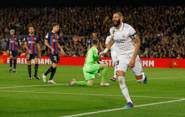Real Madrid's Karim Benzema celebrates scoring their fourth goal to complete his hat-trick during the opa del Rey Semi Final Second Leg - FC Barcelona v Real Madrid soccer match at Camp Nou inBarcelona, Spain, on April 5, 2023. (Albert Gea/Reuters)