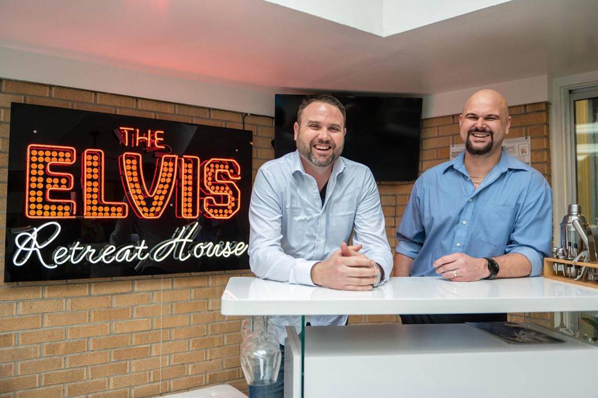 Chris Bingham, left, and Cody Bellah are two of the four owners of the new Elvis Retreat House, an Airbnb in Independence, Missouri. The four friends remodeled and redecorated the once-private home themselves over the last four months. (Emily Curiel/The Kansas City Star/TNS)