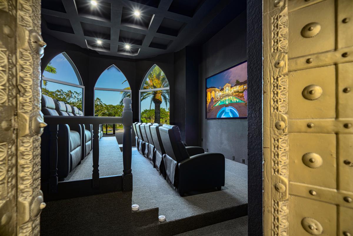 The home theater is ideal for enjoying movies or watching televised sporting events, with two levels of premium seating. (Courtesy of The Carroll Group)