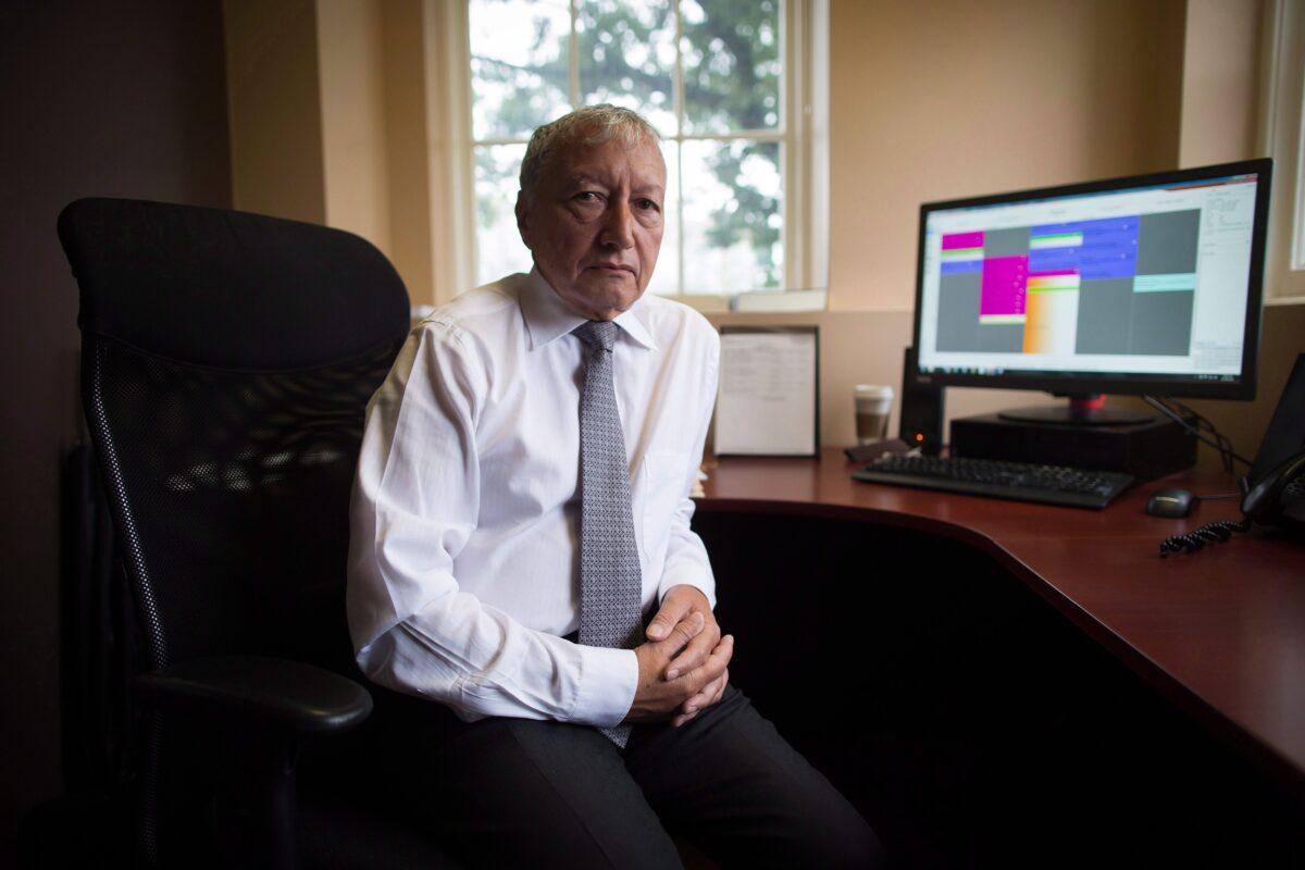 Dr. Brian Day, medical director of the Cambie Surgery Centre, sits for a photograph at his office in Vancouver on Aug. 31, 2016. (The Canadian Press/Darryl Dyck)