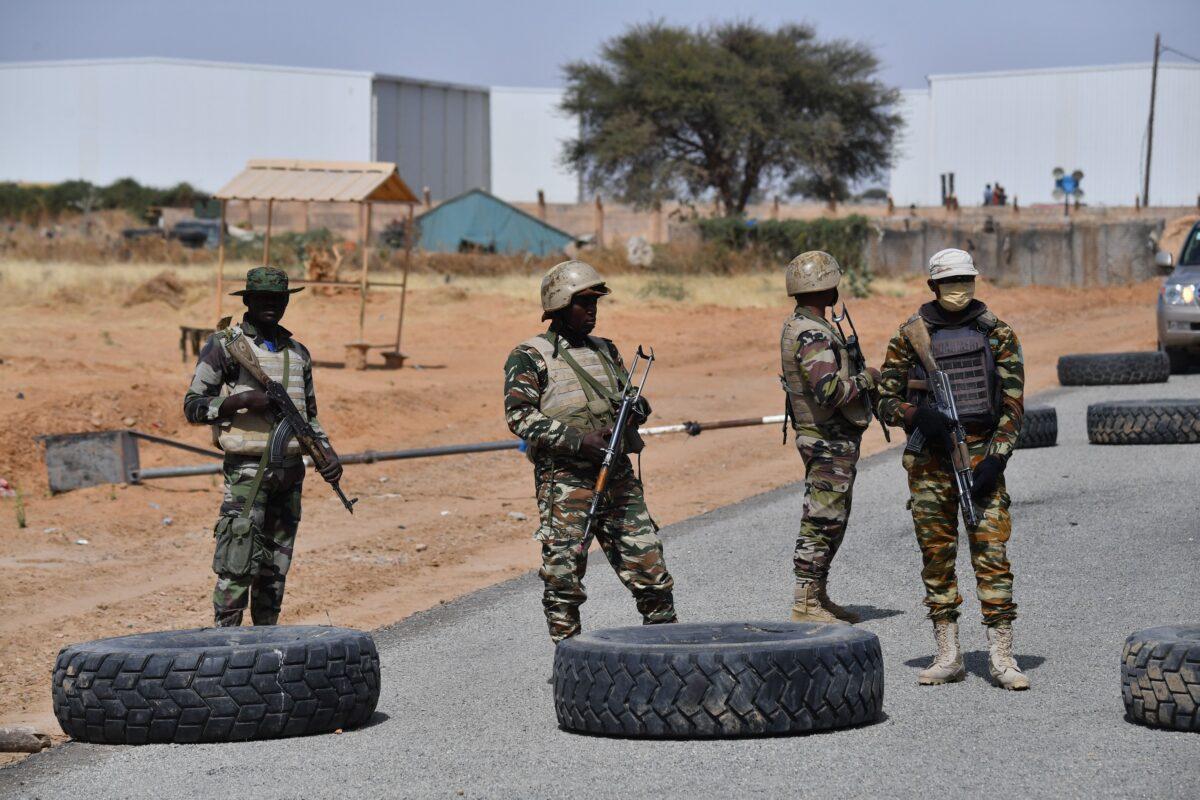 Nigerien soldiers stand guard outside the Diffa airport in southeast Niger, near the Nigerian border, on Dec. 23, 2020. (Issouf Sanogo/AFP via Getty Images)