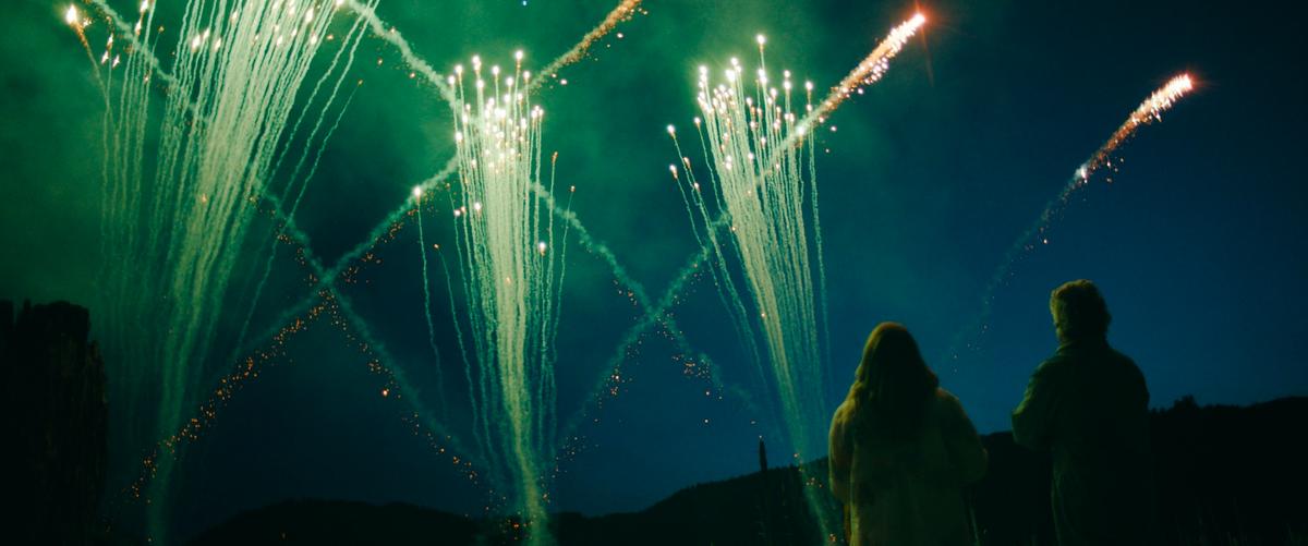 Maggie (Dianna Agron) helps her dad (Thomas Haden Church) set off elaborate, color-coded fireworks in an attempt to send a message to extraterrestrials, in "Acidman." (Brainstorm media)