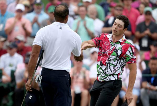 Viktor Hovland of Norway and Tiger Woods of the United States shake hands on the 18th green during the first round of the 2023 Masters Tournament at Augusta National Golf Club in Augusta, Georgia on April 6, 2023. (Patrick Smith/Getty Images)