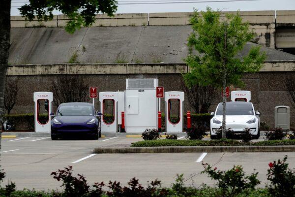 Tesla electric vehicles (EVs) fast-charge using Tesla Superchargers at a Buc-ee’s travel center and gas station in Baytown, Texas, on March 18, 2023. (Bing Guan/Reuters)