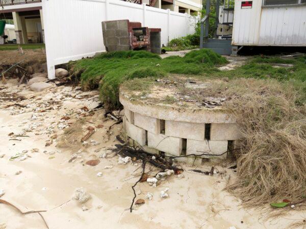 A partially exposed cinderblock cesspool pit with a lid on a badly eroding shoreline in Punaluu, Hawaii, on Jan. 26, 2015. (Hawaii Department of Land and Natural Resources via AP)