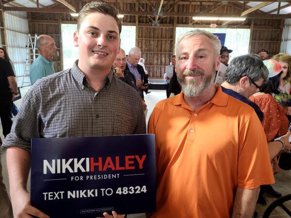 Carter Senf, 17, (L) and his dad Steve Senf of Gilbert, S.C., at Nikki Haley's campaign speech on April 6, 2023. (Dan M. Berger/The Epoch Times)
