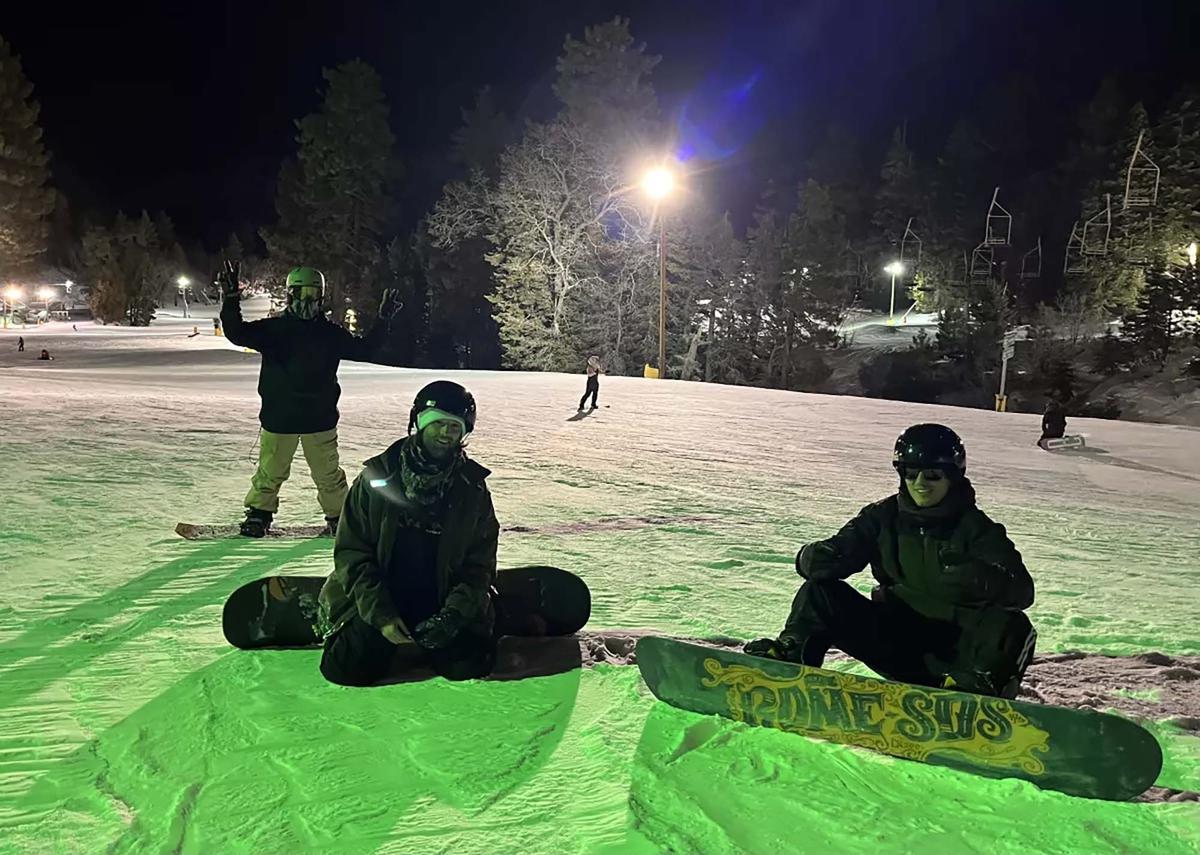 From left, Daniel Galan, Braden Walker and Lawrence Doherty take a brief rest between snowboarding runs at Mountain High in the San Gabriel Mountains. (Ryan Fonseca/Los Angeles Times/TNS)
