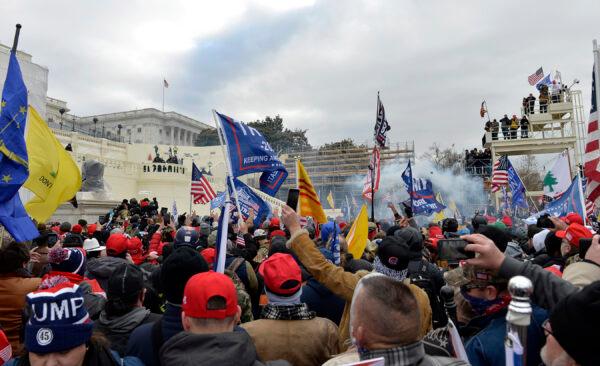 Supporters of US President Donald Trump clash with police and security forces outside the Capitol Building in Washington DC on January 6, 2021. (Joseph Prezioso /AFP via Getty Images)