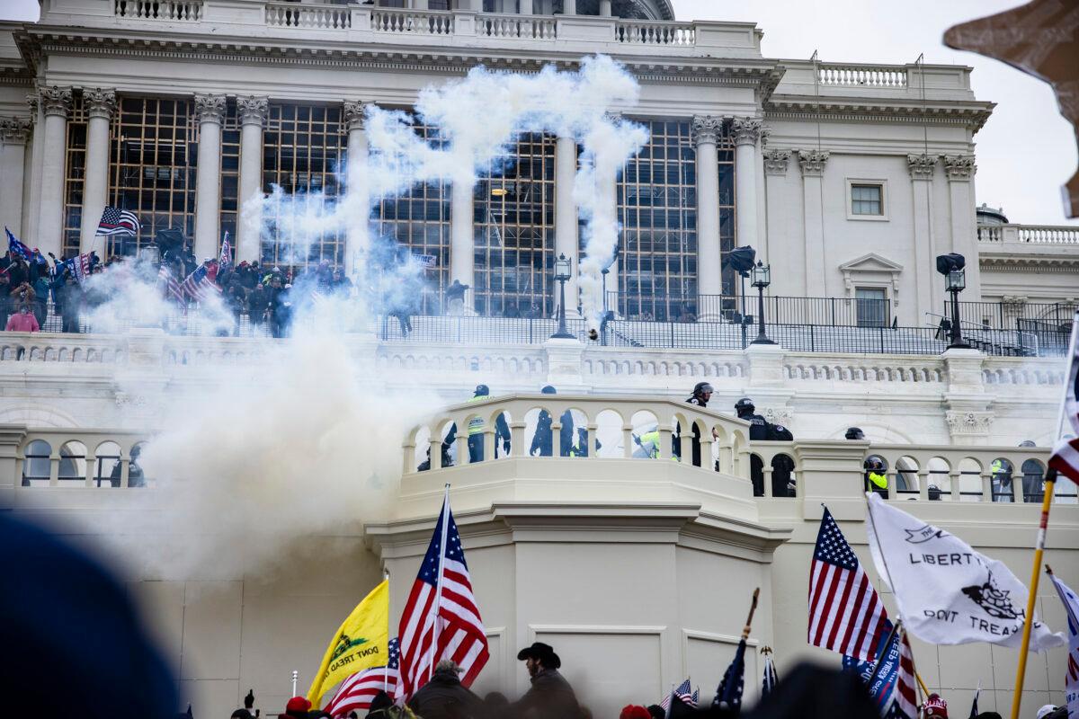 Tear gas is fired into the densely packed crowds on the west side of the U.S. Capitol on Jan. 6, 2021. (Samuel Corum/Getty Images)