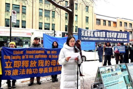 Falun Gong practitioner Cong Xinmiao protests in front of the Chinese Consulate in Montreal, Canada for the release of her mother, who was sentenced to 4 years in prison in March. (minghui.org)