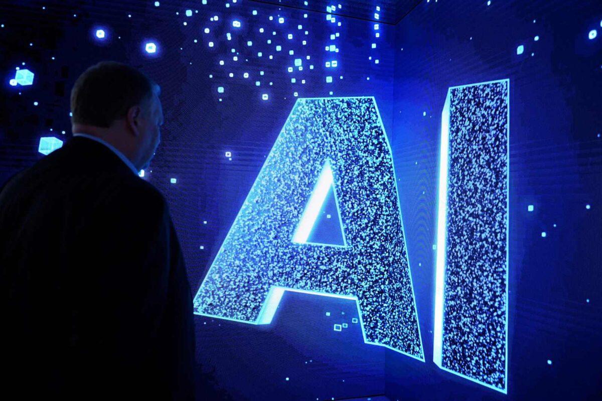 A visitor watches an AI sign on an animated screen at the Mobile World Congress (MWC), the telecom industry's biggest annual gathering, in Barcelona. (Josep Lago/AFP via Getty Images)