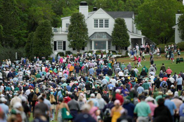 Patrons evacuate the course after play was suspended during the second round of the Masters golf tournament at Augusta National Golf Club in Augusta, Ga., on April 7, 2023. (Charlie Riedel/AP Photo)