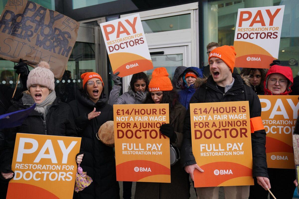 Striking NHS junior doctors on the picket line outside Queen Elizabeth Hospital in Birmingham, England, on March 13, 2023. (Jacob King/PA)
