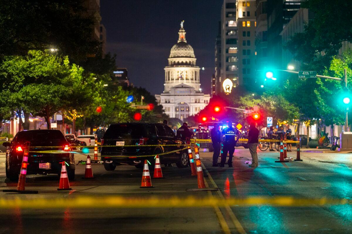 Austin police investigate a homicide shooting that occurred at a demonstration in Austin, Texas on July 25, 2020. (Stephen Spillman/Austin American-Statesman via AP)