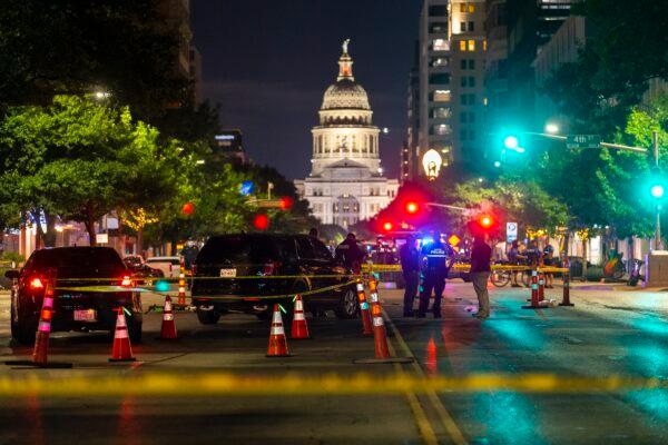Austin police investigate a homicide shooting that occurred at a demonstration in Austin, Texas, on July 25, 2020. (Stephen Spillman/Austin American-Statesman via AP)