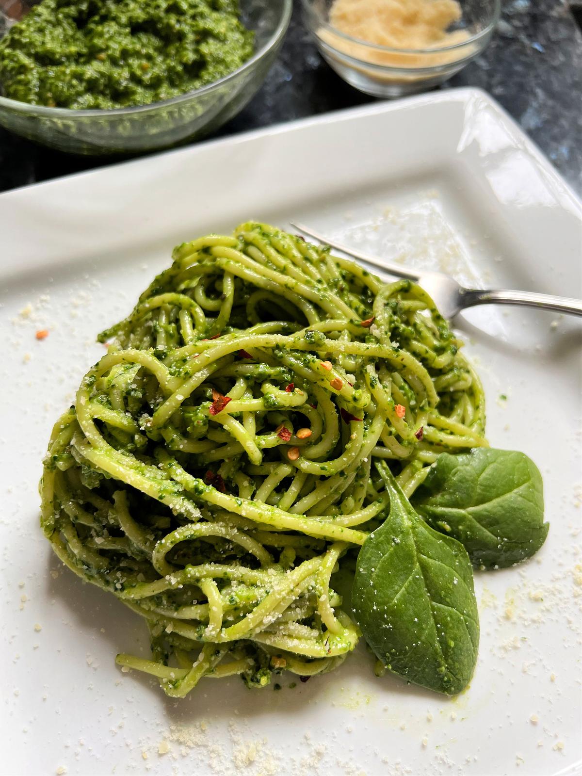 Green spaghetti is dressed in a lemony spinach pesto. (Gretchen McKay/Pittsburgh Post-Gazette/TNS)