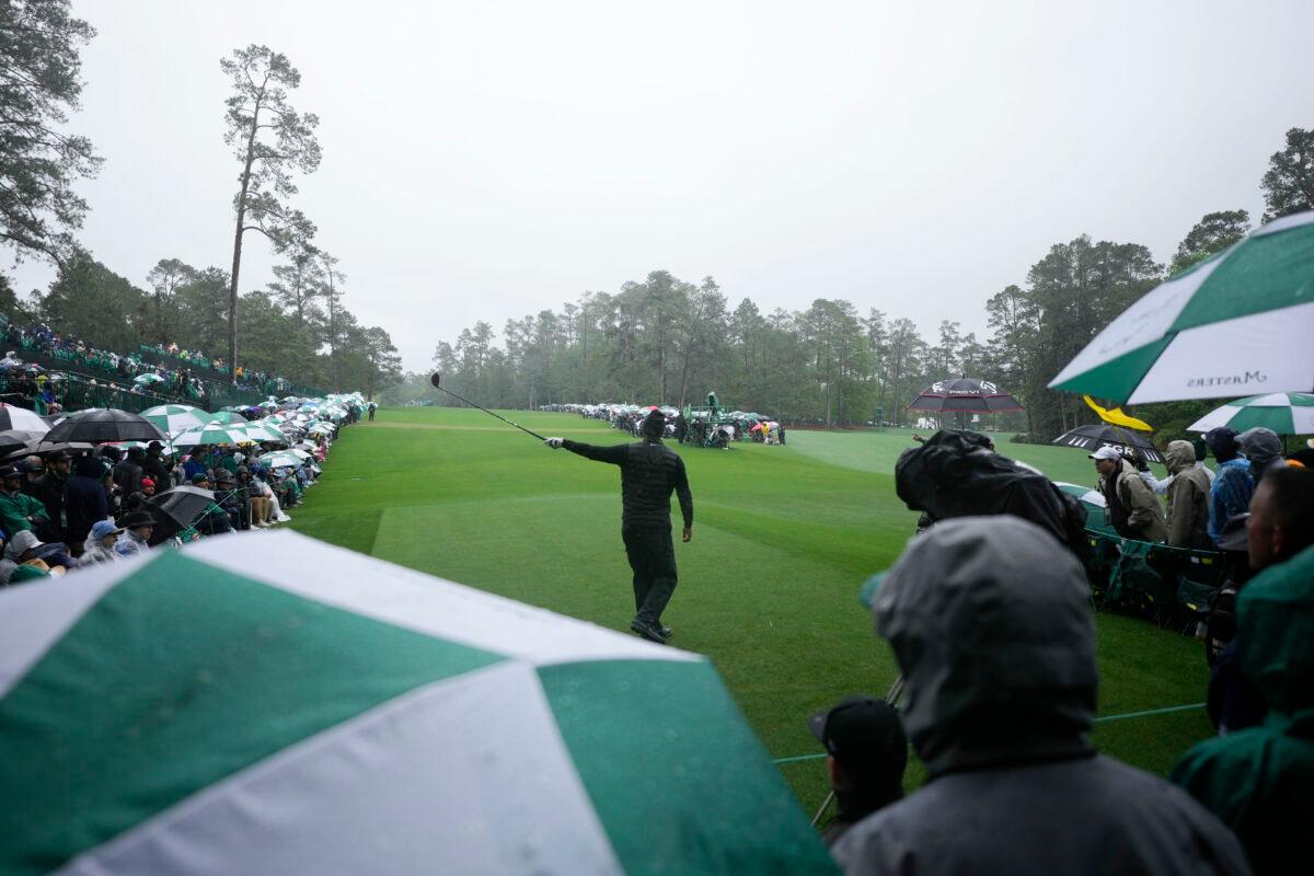 Tiger Woods points in the direction of his tee shot on the 14th hole during the weather delayed third round of the Masters golf tournament at Augusta National Golf Club in Augusta, Ga., on April 8, 2023. (AP Photo/Matt Slocum)