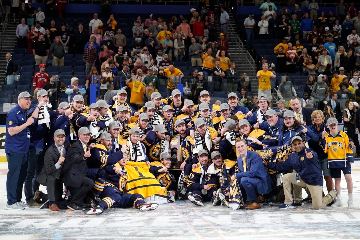 Quinnipiac players pose for photo after defeating Minnesota during overtime of the championship game in the Frozen Four NCAA college hockey tournament in Tampa, Fla., on April 8, 2023. (Chris O'Meara/AP Photo)