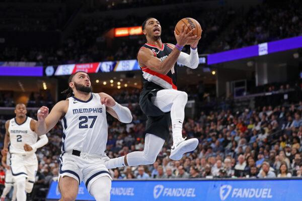 Shaquille Harrison (00) of the Portland Trail Blazers goes to the basket against David Roddy (27) of the Memphis Grizzlies during the second half at FedExForum in Memphis on April 4, 2023. (Justin Ford/Getty Images)