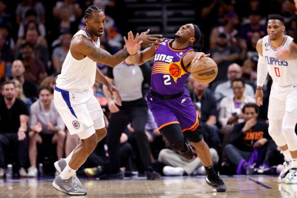 Kawhi Leonard (2) of the Los Angeles Clippers fouls Josh Okogie (2) of the Phoenix Suns during the first half of the game at Footprint Center in Phoenix on April 09, 2023. (Chris Coduto/Getty Images)