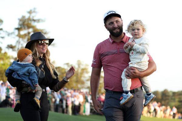 Jon Rahm of Spain celebrates with his sons Kepa Cahill Rahm and Eneko Cahill Rahm and his wife, Kelley, on the 18th green after winning the 2023 Masters Tournament at Augusta National Golf Club in Augusta, Ga., on April 9, 2023. (Patrick Smith/Getty Images)