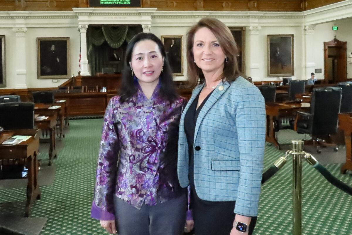 Falun Gong practitioner Crystal Chen (L) and Texas state Sen. Angela Paxton pose for a photo on March 29, 2023. (Brenda Chen/The Epoch Times)