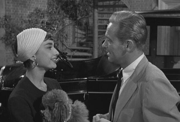 Sabrina (Audrey Hepburn) returns to her father, Thomas Fairchild (John Williams), the Larrabee family's chauffeur, in "Sabrina." (Paramount Pictures)