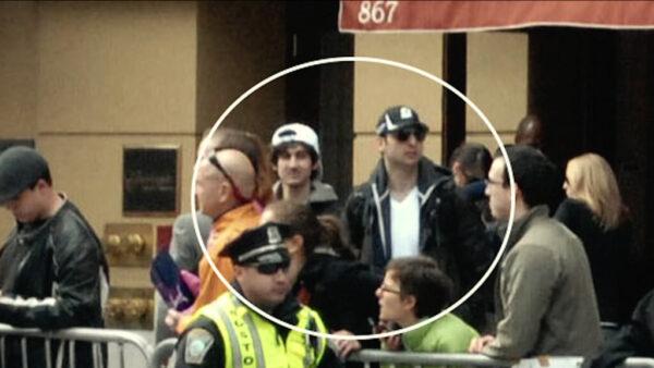 Brothers Dzhokhar (L) and Tamerlan (R) Tsarnaev are shown watching the Boston Marathon in “American Manhunt.” (Netflix)