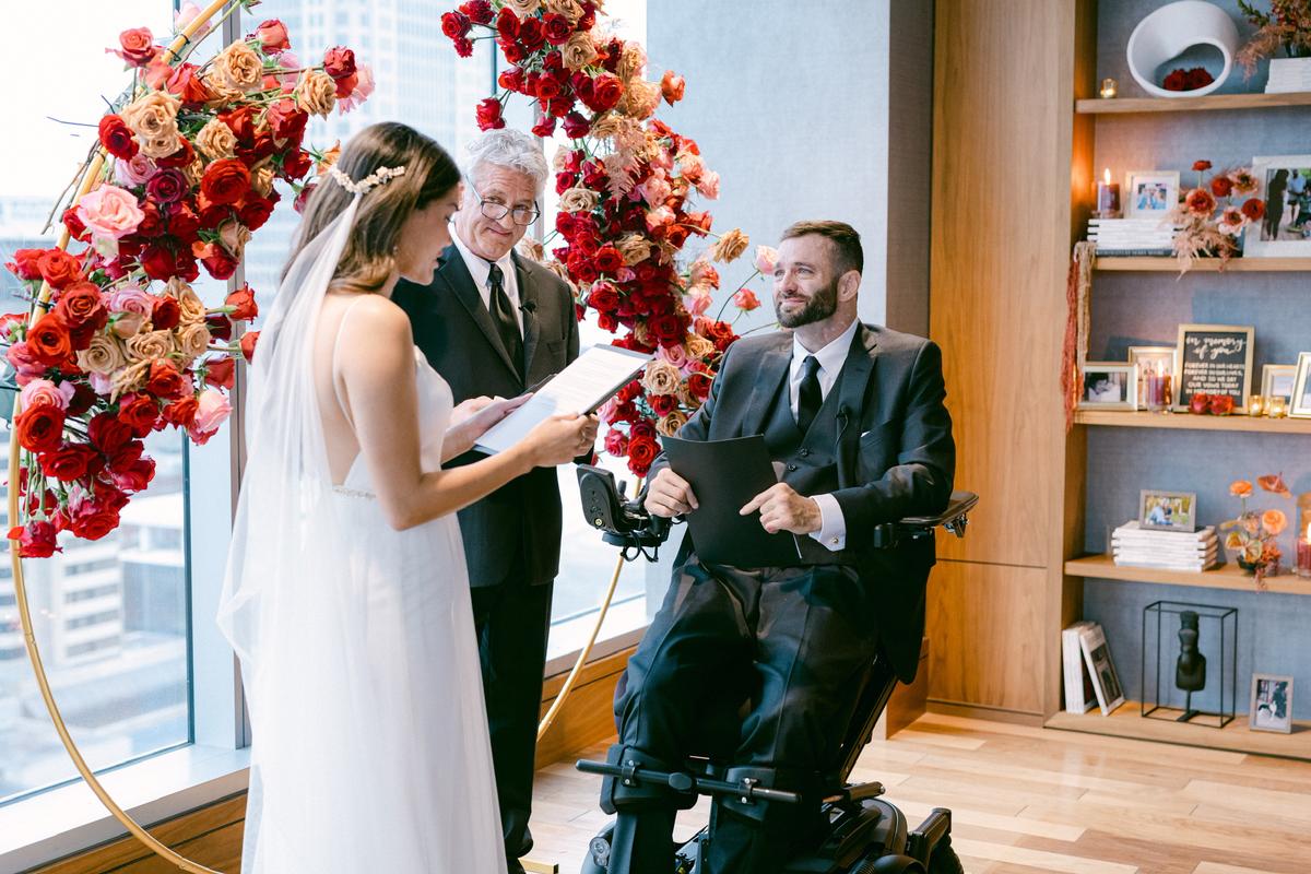 The couple exchanging their wedding wows. (Courtesy of <a href="https://positivelyparalyzed.org/">Hanna and Jerod Nieder</a>)