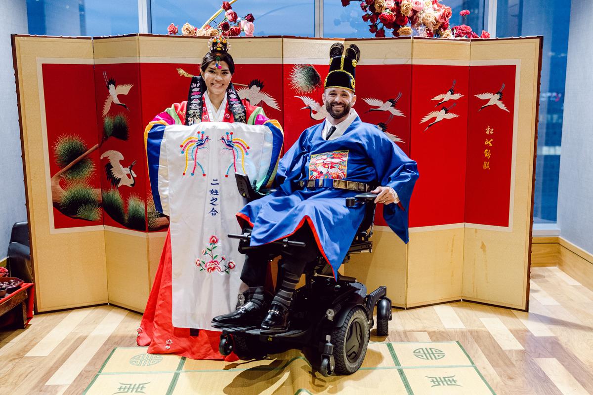 The couple at their traditional Korean wedding ceremony. (Courtesy of <a href="https://positivelyparalyzed.org/">Hanna and Jerod Nieder</a>)